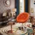 fotel-obrotowy-angelo-pomaranczowy-aranzacja-salon..webp
