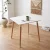 stol-bialy-skandynawski-80x80-aranzacja-salon.webp